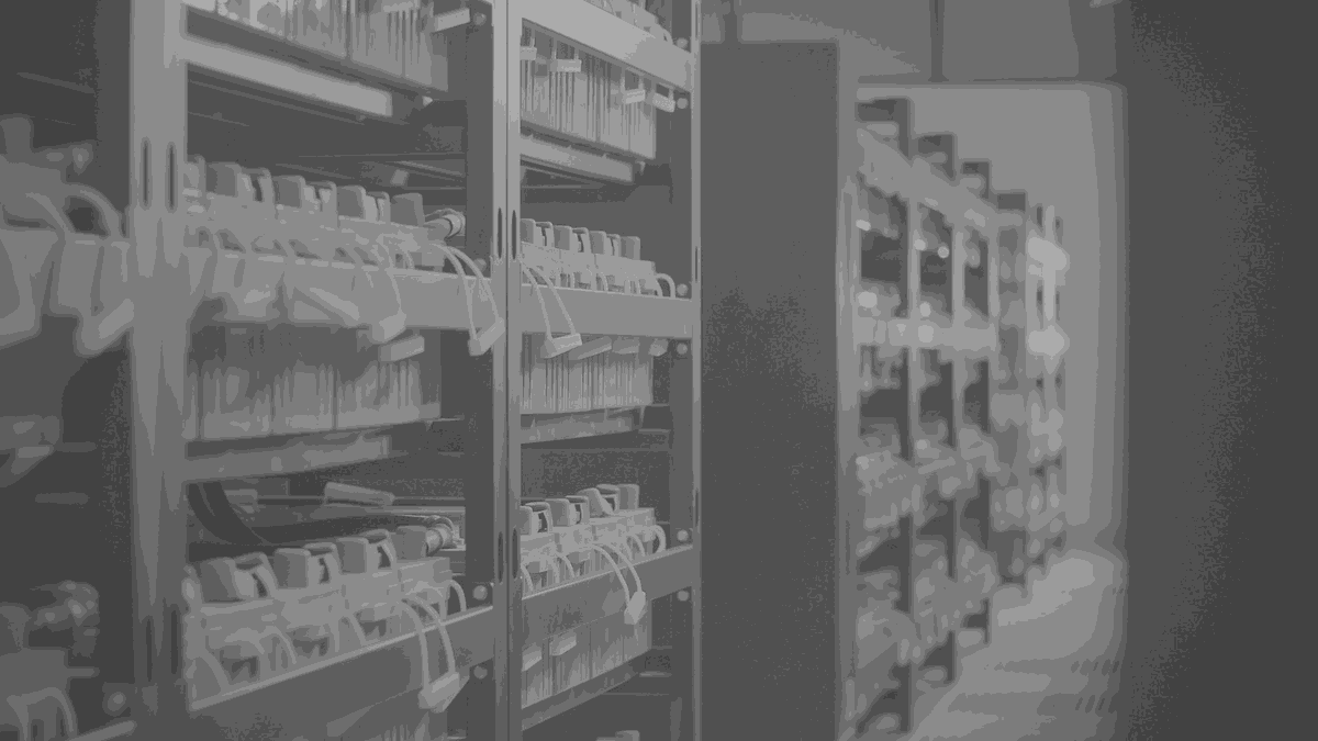 Rows of cabinets in a plant room, each door carrying its own labelled switchgear.